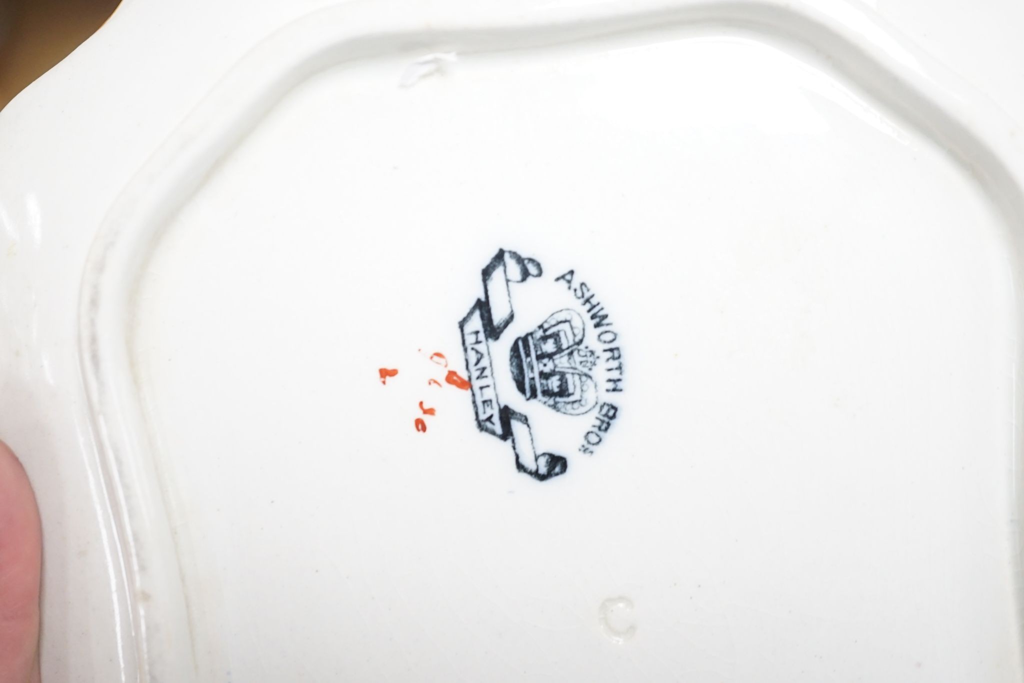 An Ashworths ironstone landscape pattern part dinner service